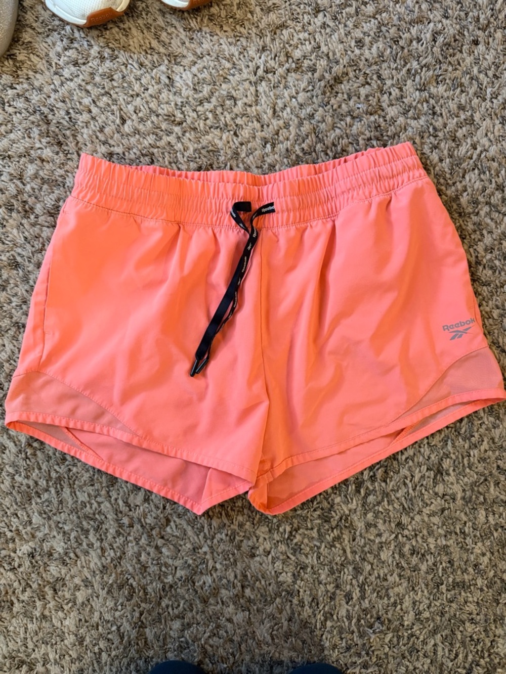 Reebok Women’s Neon Coral Athletic Shorts with Black Drawstring